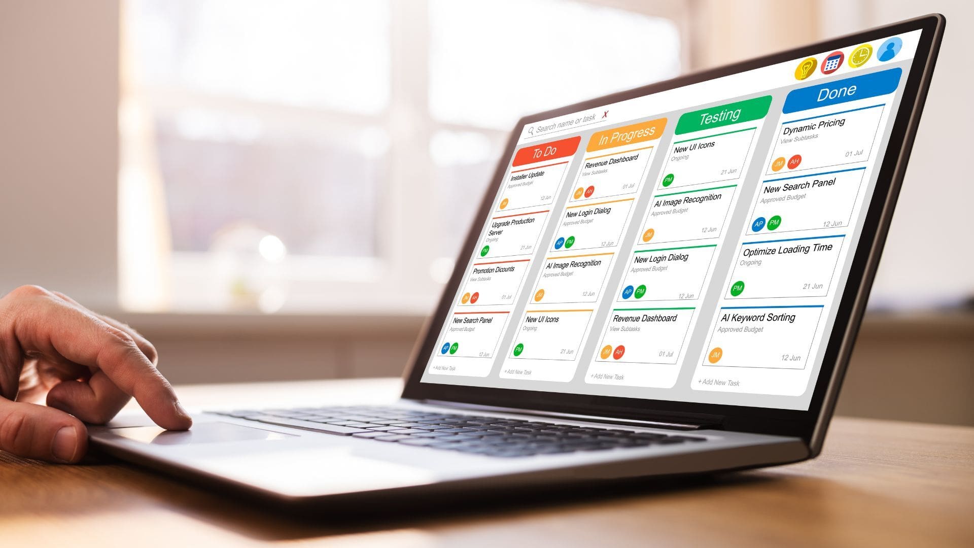 A laptop on a table displaying a kanban board